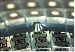 Die removed from tape using die eject pin push up needle Die removed from tape using die eject pin